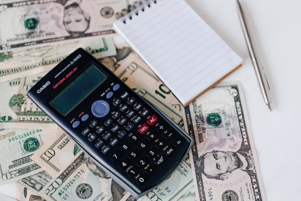 Accountant reviewing tax documents with a calculator